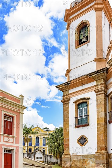 Old cobblestone street with houses and church in colonial architecture in the famous city of Ouro Preto in Minas Gerais