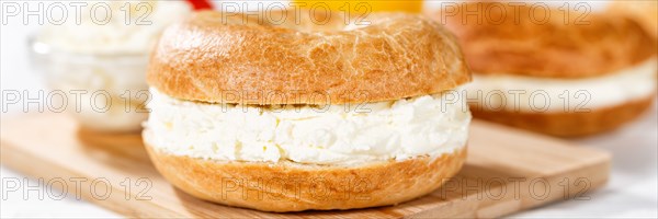 Bagel sandwich for breakfast topped with cream cheese close-up panorama in Stuttgart