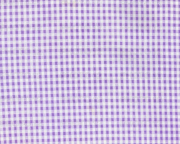 Light chequered purple and white fabric texture background