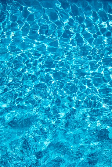 Wavy blue water surface with reflections