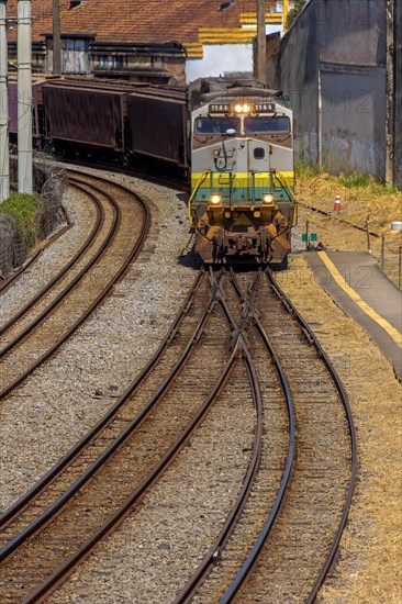 Old freight train worn out by time and use arriving in the city of Belo Horizonte