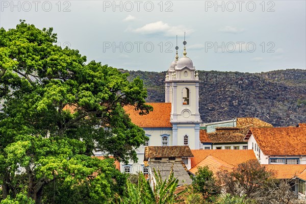 Towers of the cathedral of the historic city of Diamantina in Minas Gerais among the roofers and with the mountains in the background