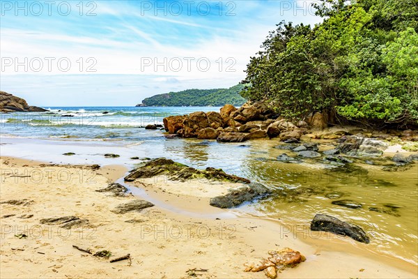 River flowing into the beach between the sea