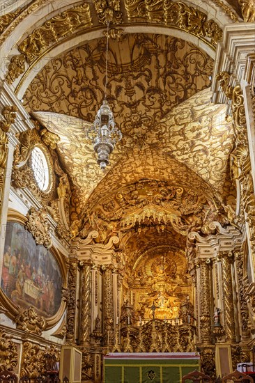 Interior and altar of historic church all painted in gold with baroque architecture in the old city of Tiradentes in Minas Gerais state