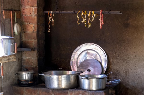 Old popular brazilian kitchen and utensils lighting by a window