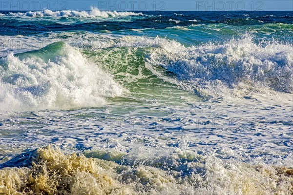 Waves in the sea of Ipanema beach in the city of Rio de Janeiro on a sunny day with a lot of wind