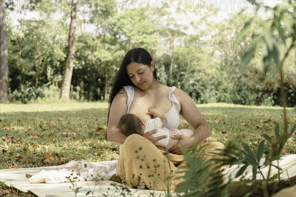 The mother is breastfeeding her baby