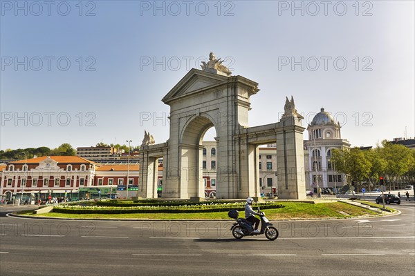 Monumental gate Puerta de San Vicente in a roundabout