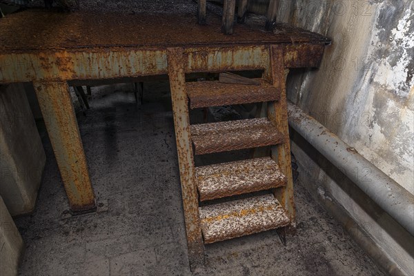 Rusty metal stairs in a former paper factory