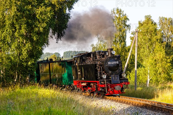 Steam train Rasender Roland railway steam locomotive on the island of Ruegen in Serams