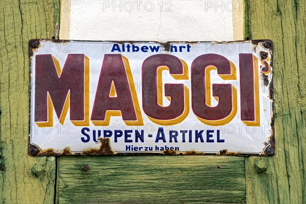 Rusty historical enamel sign