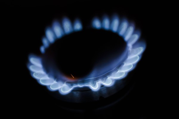 Symbolic photo on the subject of rising costs for gas. Flames in a gas cooker. Berlin