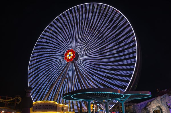 Illuminated flower wheel at the Prater