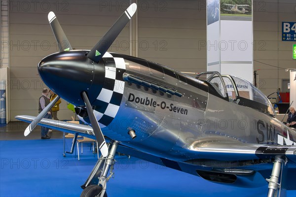 The front part of the aircraft with the propeller with engine cowling