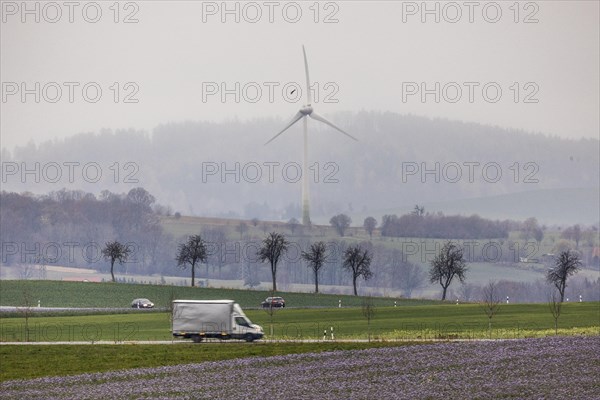 Cars driving along a country road in Meuselwitz