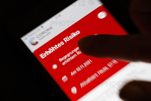 The Corona Warn app displays the words Increased Risk on a smartphone. Berlin