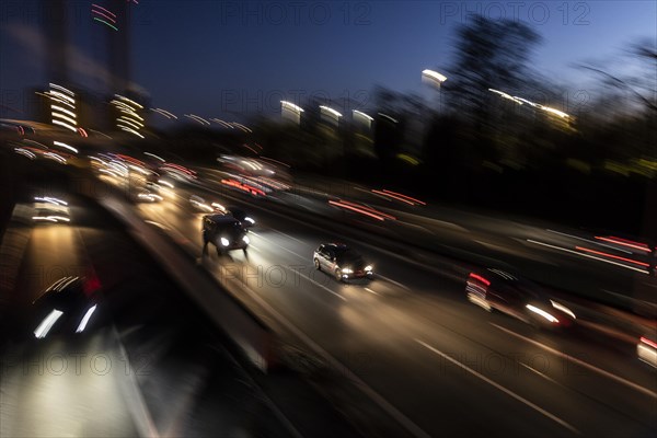 Traffic on the A100 looms at blue hour in Berlin