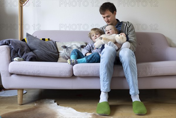 Subject: Father with two children aged nine months and three years.