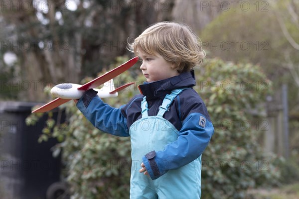 Toddler with a plane