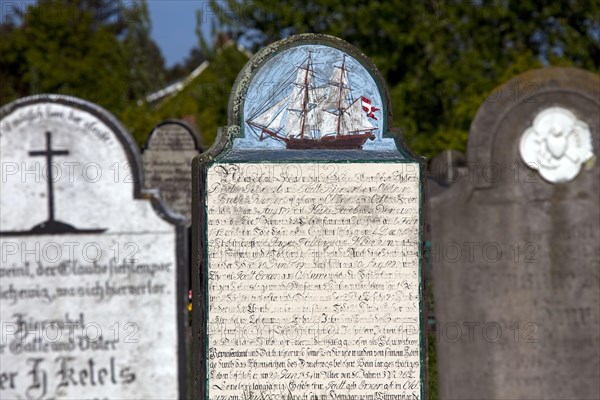 Tombstones of sailors at the graveyard of the St. Laurentii church at Suederende on the island of Foehr