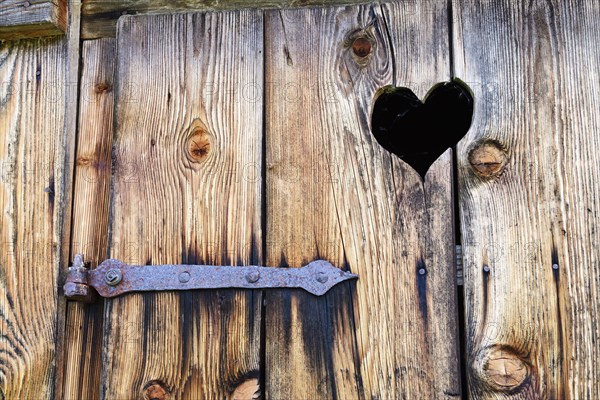 Traditional Bavarian wooden toilet door with heart