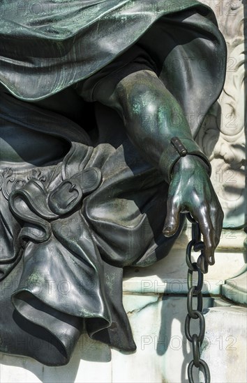 Detail photo of the chained warriors at the base of the equestrian statue of Frederick William of Brandenburg