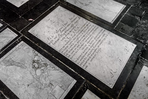 18th century epitaph in Latin on white marble gravestone