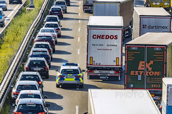 Police vehicle driving through an emergency lane