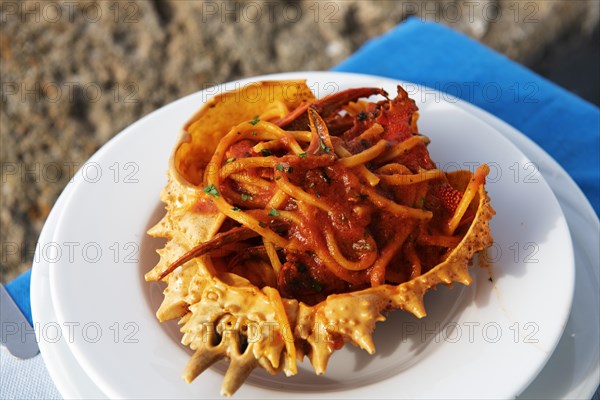 Spaghetti with crabmeat served in crab shell