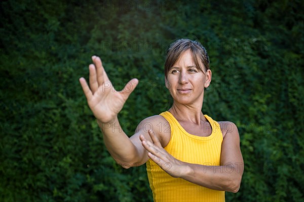 Close up of a woman practitioner of tai chi and chi kung. A person who participates in Chinese disciplines to improve their physical and mental well-being