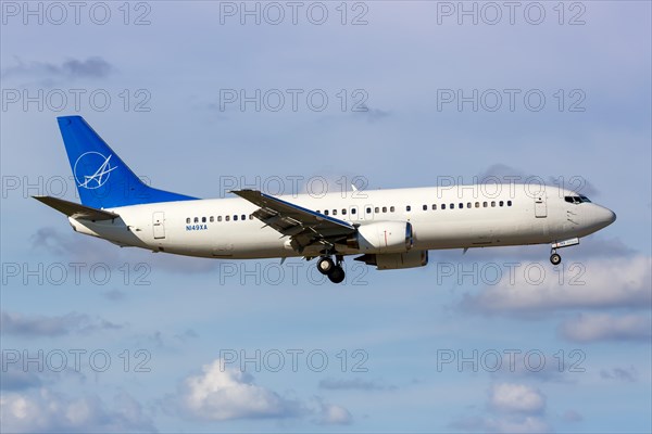 A Boeing 737-400 aircraft of iAero Airways with registration N149XA at Miami Airport