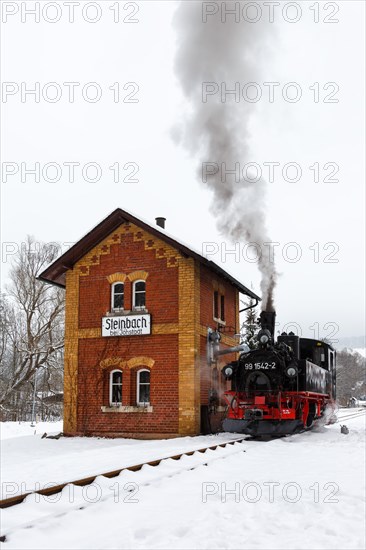 Steam train of the Pressnitztalbahn railway Steam locomotive in winter in Steinbach