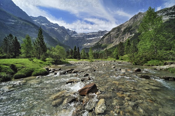 Mountain stream running through the Cirque de Gavarnie and the Gavarnie Falls