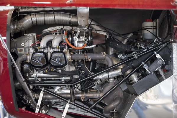 View into the engine compartment of a biplane with a Rotax 912 reciprocating engine