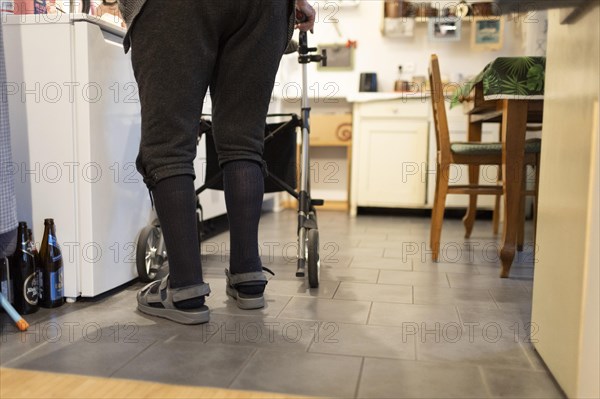 Man with Rolator in his kitchen.