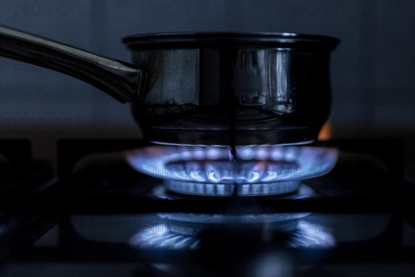 A blue flame on a gas cooker