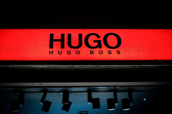 Logos of the fashion manufacturer HUGO Boss at a branch in Berlin