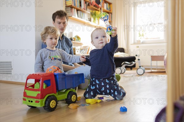 Subject: Father with two children aged nine months and three years.