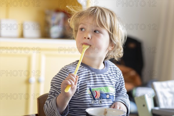 Subject: Toddler having breakfast