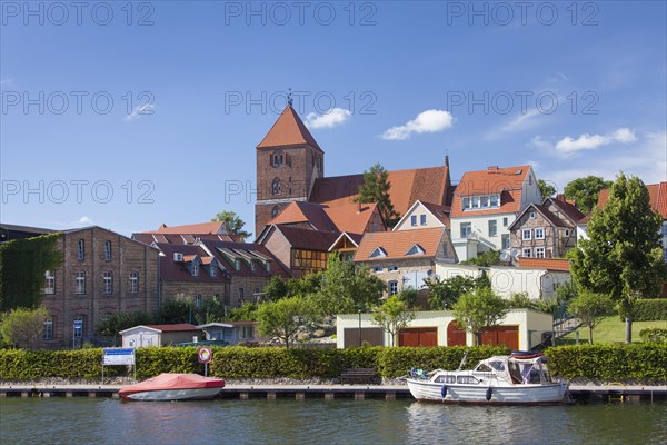 Pleasure boat in the Elde river moored at Plau am See