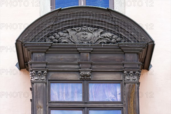 Detail of the historic oriel with pigeon grille