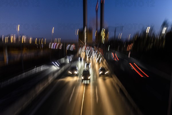 Traffic on the A100 looms at blue hour in Berlin