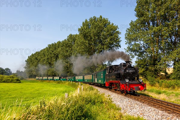 Steam train Rasender Roland railway steam locomotive on the island of Ruegen in Serams