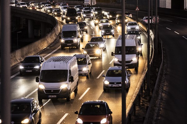 Congested traffic on the A100 looms at blue hour in Berlin