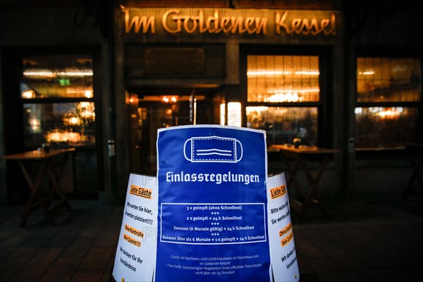 A sign outside a pub indicates the new catering access restrictions to combat the COVID-19 pandemic in Duesseldorf