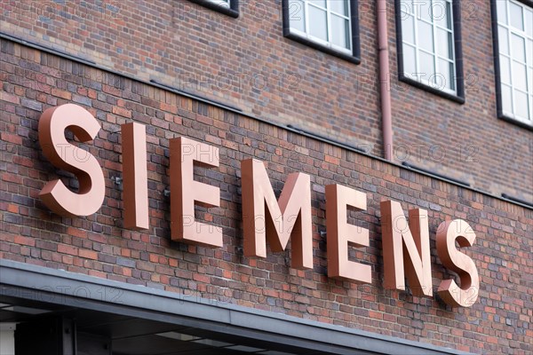 A Siemens company sign in front of a branch office in Siemensstadt in Berlin