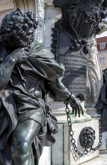 Detail photo of the chained warriors at the base of the equestrian statue of Frederick William of Brandenburg