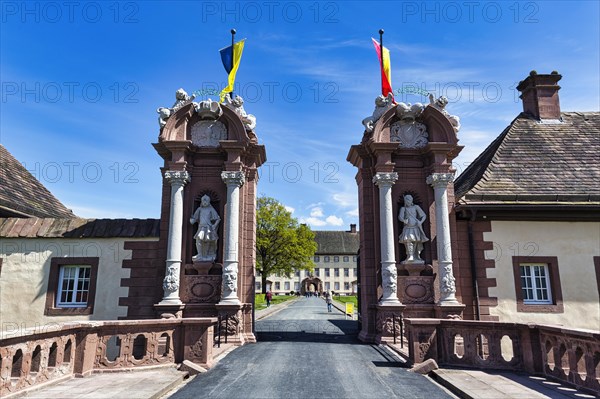 Entrance gate with stone figures