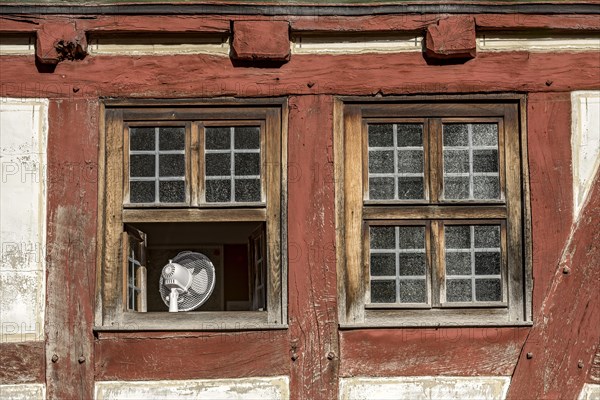 Window with fan to cool the room in hot weather