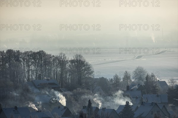 Smoke is visible from the chimneys on an icy morning in Koenigshain